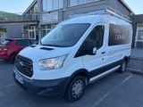 the white van is parked in the parking lot outside of the building
