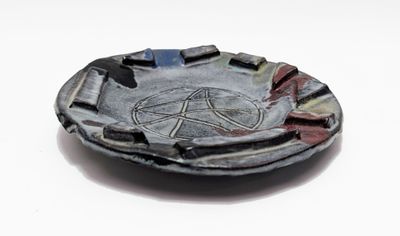 a black and white plate with a pentagram on it