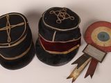 three hats that are sitting next to each other on a table