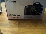 a canon eos 500d box on the table