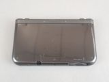 a silver nintendo 3ds sitting on a white surface