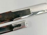 two knives that are sitting on a table