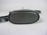 black leather belt bag with a metal clasp on a white background
