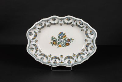 a white plate with blue and yellow flowers on it