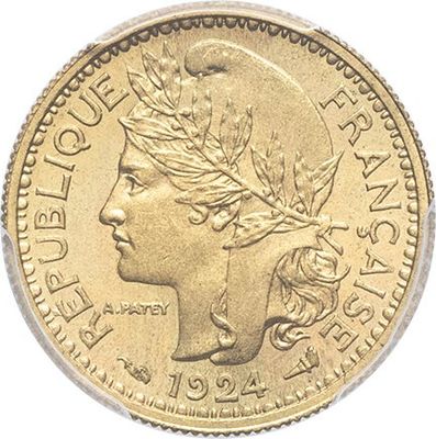 a close up of a gold coin with a woman ' s head on it
