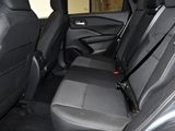 the back seats of a car are black and grey in color