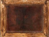 an old wooden picture frame with rusted paint on it