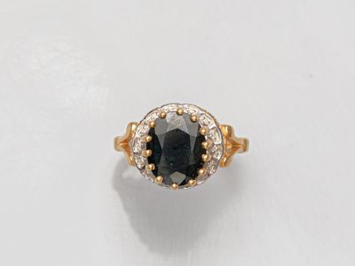 Bague en or deux tons 750°/°° (18K), sertie d'un saphir somb… - Photo 1