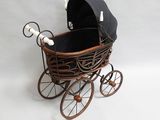 a baby stroller with a black cover on it