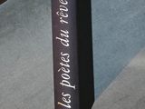 a book that is sitting on the floor next to a chair