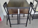 two chairs and a table in a room