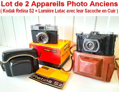 tout un tas de modèles d'appareils photo posés sur une table