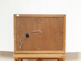 a picture of a wooden easel with a wire on it