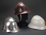 three helmets that are sitting on top of each other