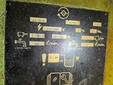 a sign on the side of a yellow machine