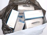 a bag full of electronic equipment that is sitting on a table