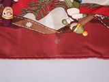 a red pillow with a picture of a snowman and a monkey on it