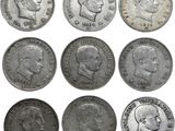 une image représentant un ensemble de vieilles pièces de monnaie sur lesquelles figurent des visages
