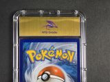 a close up of a pokemon trading card in a plastic case