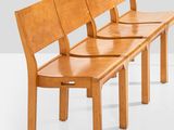 three wooden benches sitting next to each other on a white surface