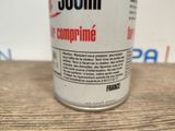 a can of soda sitting on a wooden table