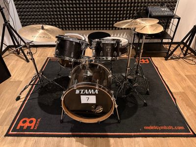 a drum set that is sitting on the floor