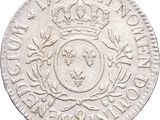 a close up of a coin with a crown on it