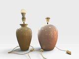 pair of ceramic table lamps in the manner of person