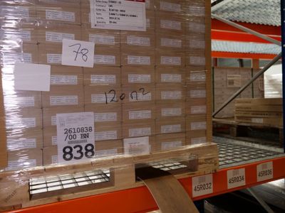 a pallet with a lot of boxes on it in a warehouse
