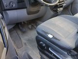 a black seat in the front of a truck with a yellow sticker on it