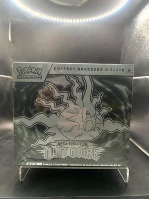 the box of the pokemon trading card is sitting on the table