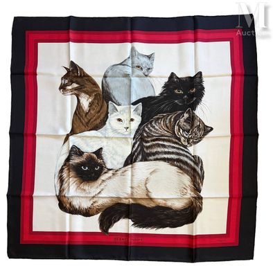 une photo d'une écharpe à motifs représentant de nombreux chats