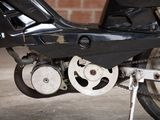 a close up of a motorcycle with a chain attached to it