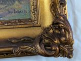 a picture of a picture of a bird in a gold frame