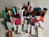 many different types of skin care products laid out on the floor