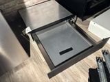 a drawer that has a door open on the floor
