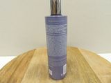 an image of a bottle of body lotion on a wooden table