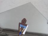 a piece of chocolate cake that is on a mirror