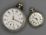 two silver pocket watches with roman numerals and roman numerals on them