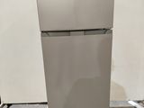 an image of a refrigerator on a pallet in a room