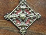 a close up of a metal object on a wooden surface