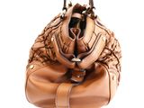 brown leather handbag with braided handles on a white background