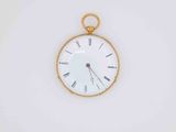 a gold pocket watch with roman numerals on the face