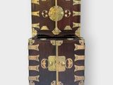 an image of a wooden chest with two doors on top of it