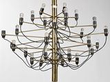 a large brass chandelier with many lights hanging from the ceiling