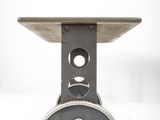 a metal table with a hole in the middle of it
