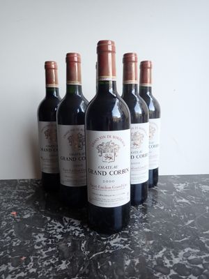 several bottles of wine are lined up on a table
