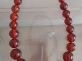 red glass beaded bracelet with silver clasp