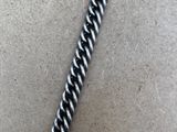 a close up of a metal chain on a table