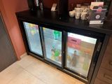 a refrigerator that has a lot of drinks inside of it